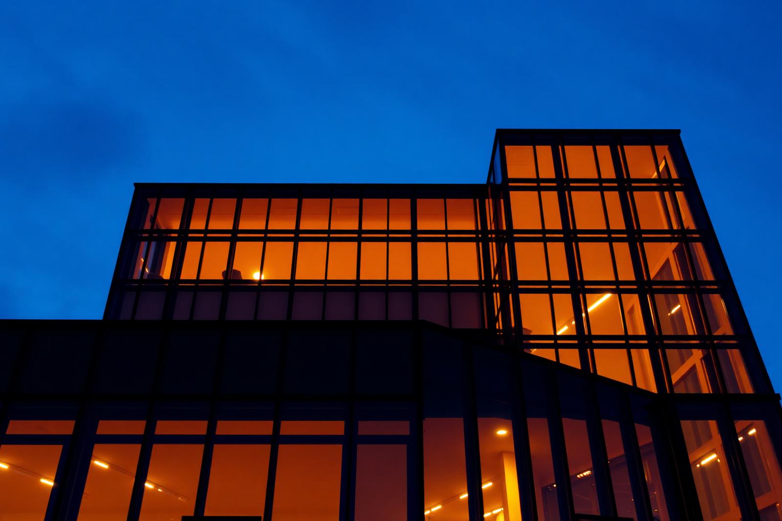 Modern office building exterior at twilight